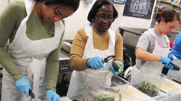 Volunteers from DC Central Kitchen prep food. Photo via Flickr Creative Commons from @dccentralkitchen.
