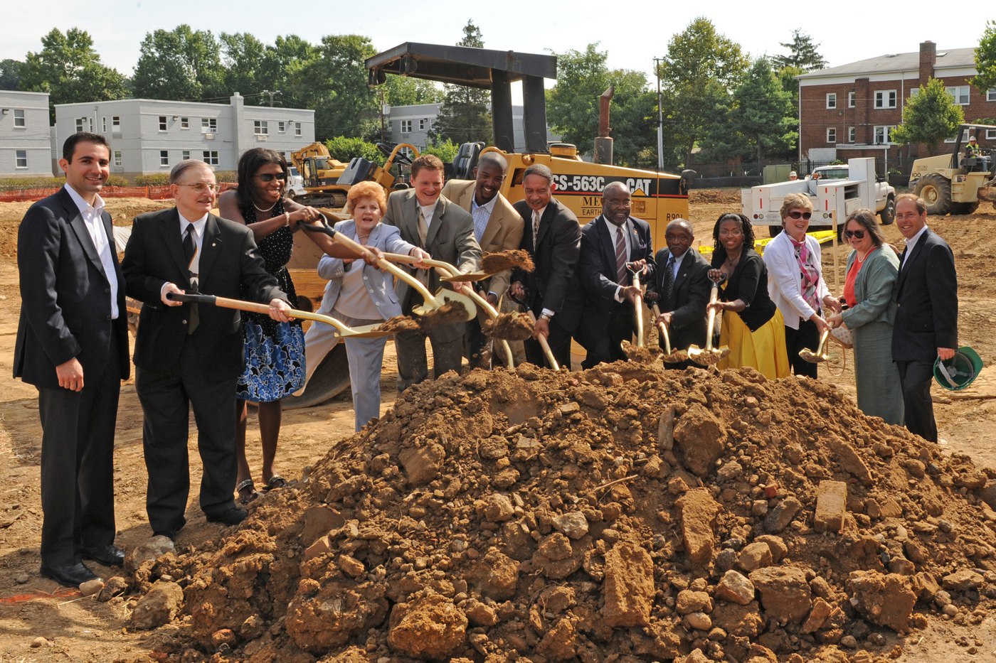 olddom053a From left to right: Ed Chaglassian of JBG, ARHA Commissioner Fletcher Johnston, Alexandria City Council Alicia Hughes, Councilwoman Del Pepper, Councilman Rob Krupicka, EYA's Brian Allan Jackson, ARHA Executive Director Roy Priest, Alexandria Mayor Bill Euille, ARHA Chairman A. Melvin Miller, ARHA Commissioner Kerry Ann Powell, ARHA Commissioner Carter Flemming, ARHA Commissioner Leslie Hagan, and EYA President Bob Youngentob.