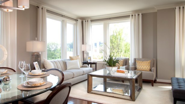 Glass tables and fabrics and paint in the same color palette keep the eyes moving.