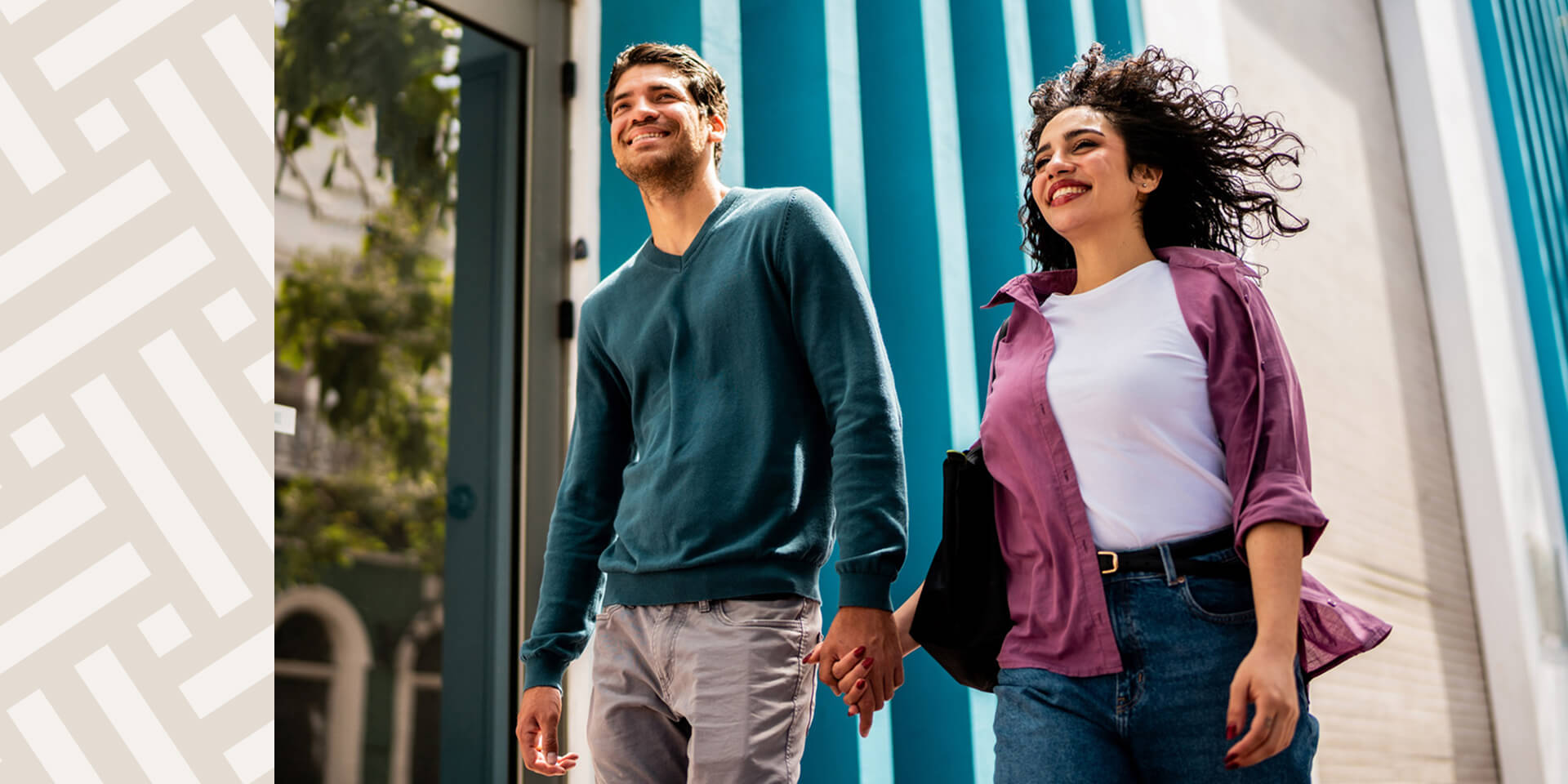 EYA-HR-HomepageFotoer-Young-Couple-Hands-While-Walking-in-City-Setting