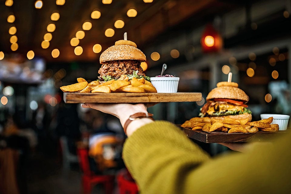 EYA_FD_Woman Carrying  Wooden Tray with Large Sandwich jpg