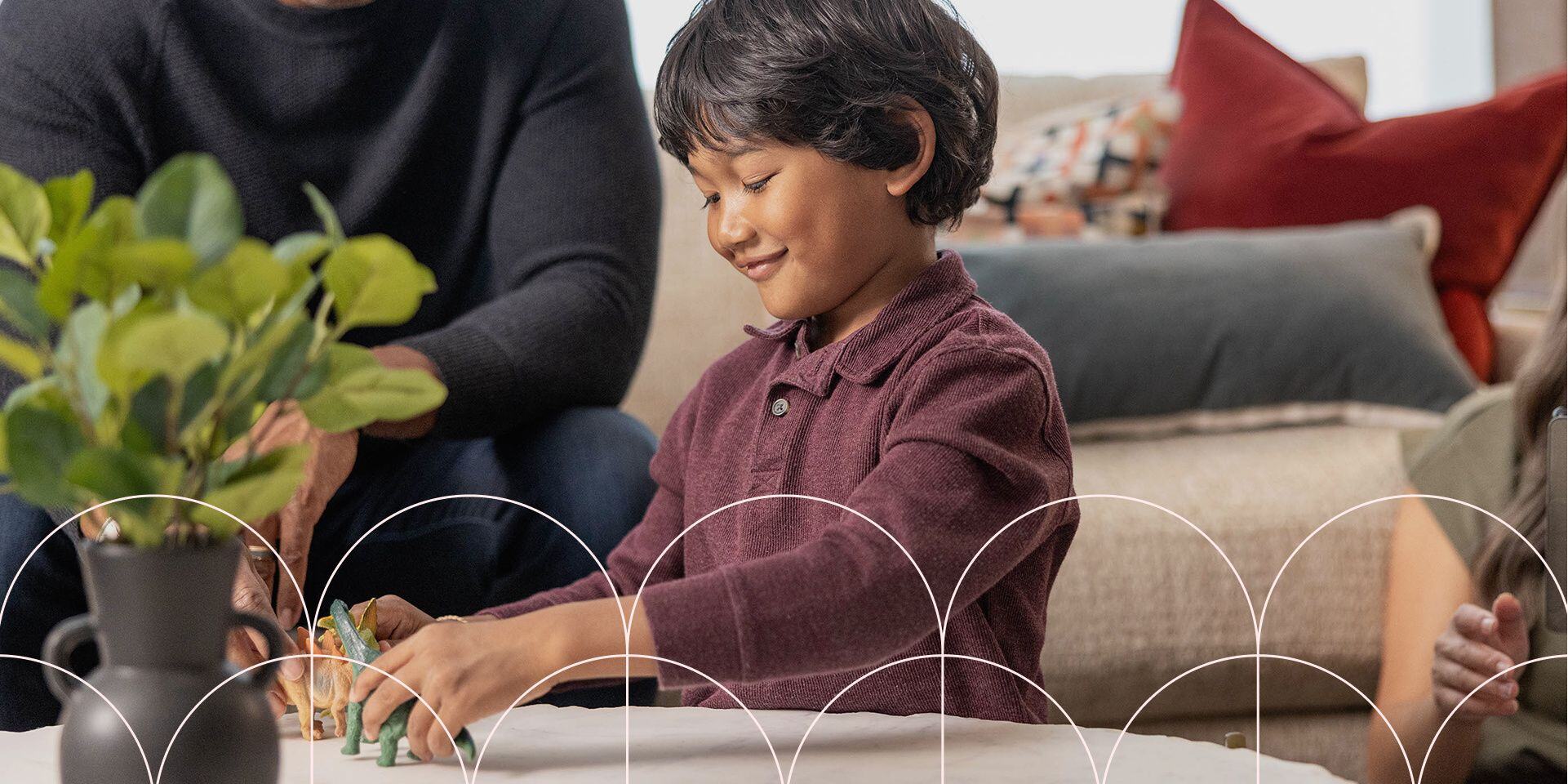 young boy playing in living room in single family home