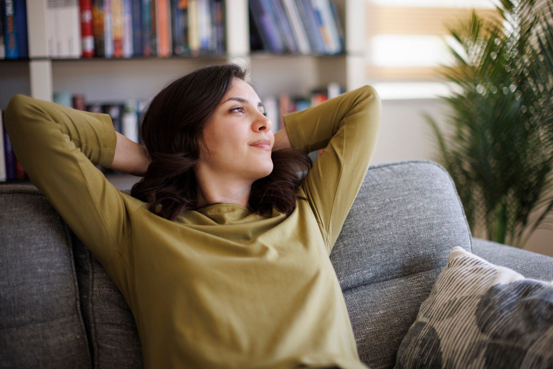 Woman Indoors on Sofa - Istockphoto