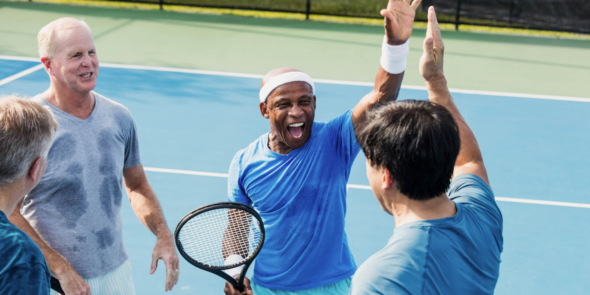 northside-friends-outside-playing-tennis